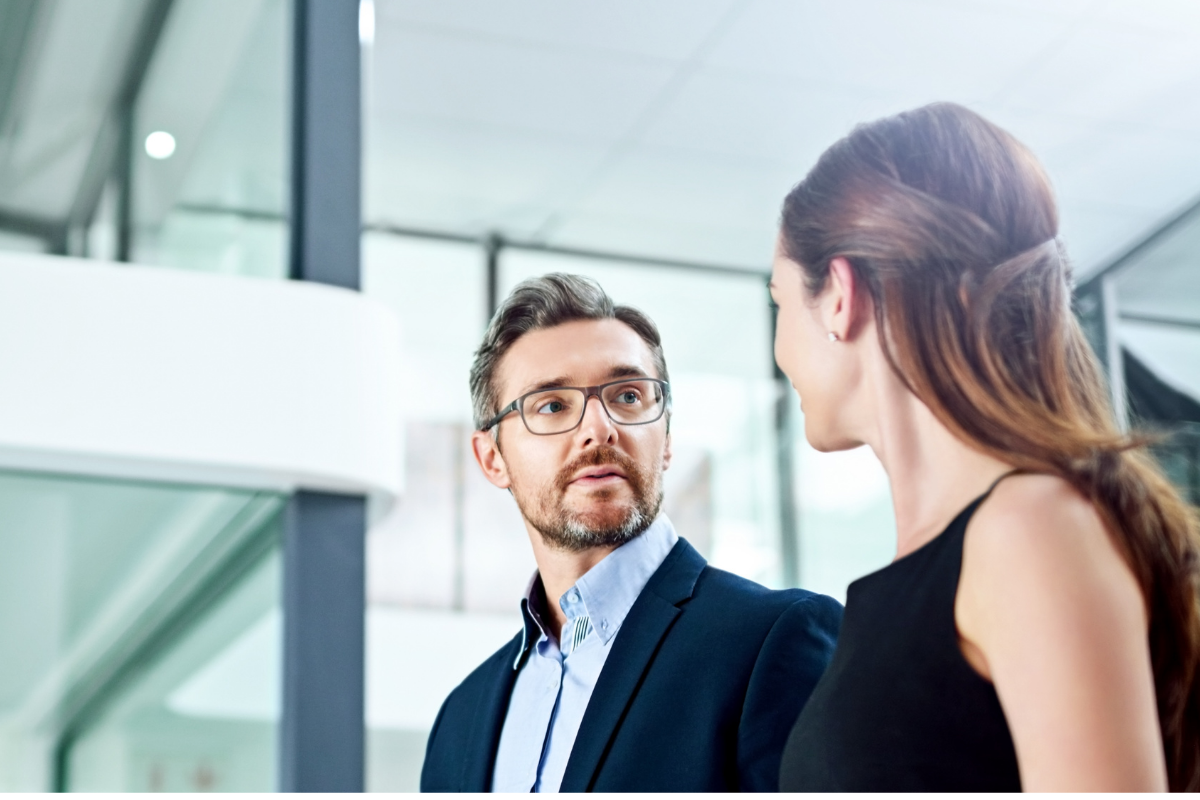 Two professionals discussing workplace investigations at Inspired HR